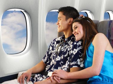 People sitting relaxed in a plane after having hypnosis for fear of flying