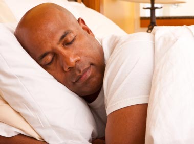 Man sleeping after having hypnosis for insomnia